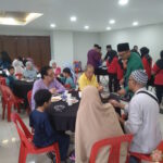 Suasana sibuk di Majlis Sambutan Hari Raya Aidilfitri 1446 Hijrah.